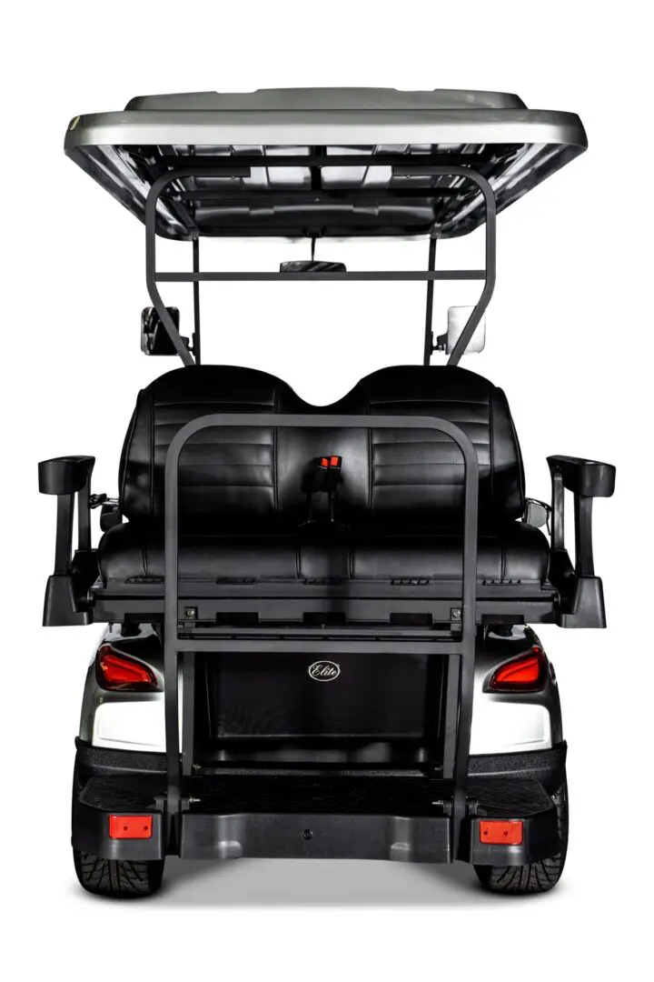 A rear view of the back seat of an electric golf cart.