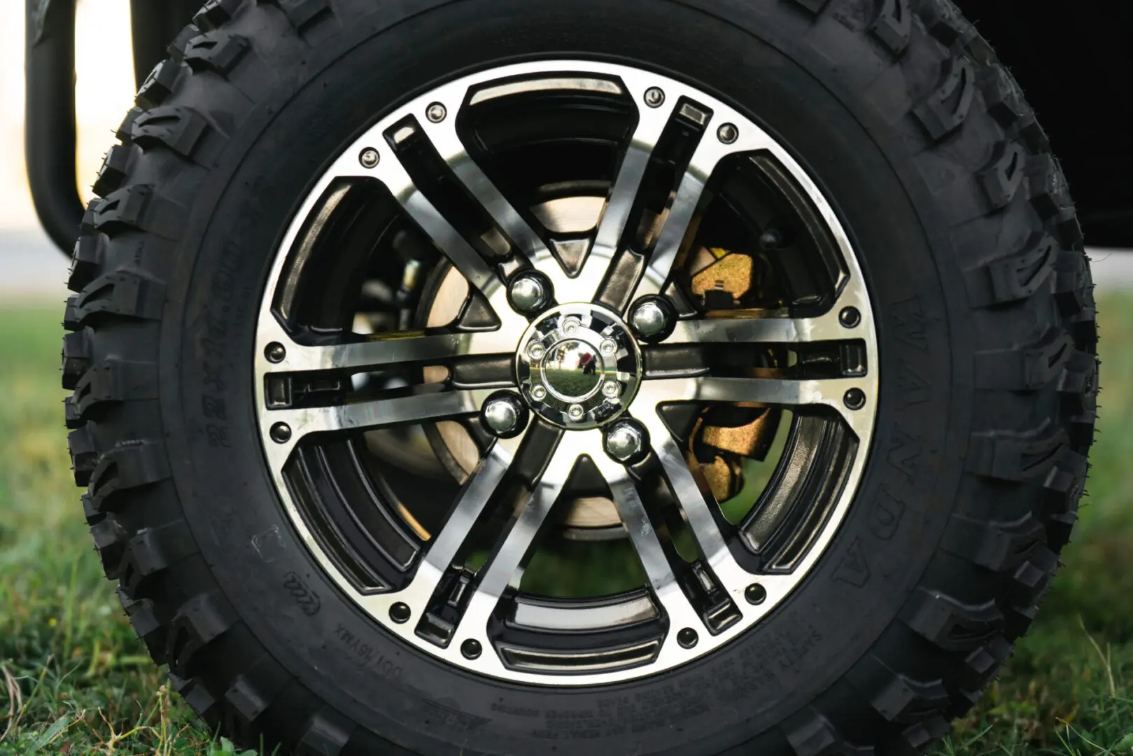 A close up of the rim and tire on a wheel.