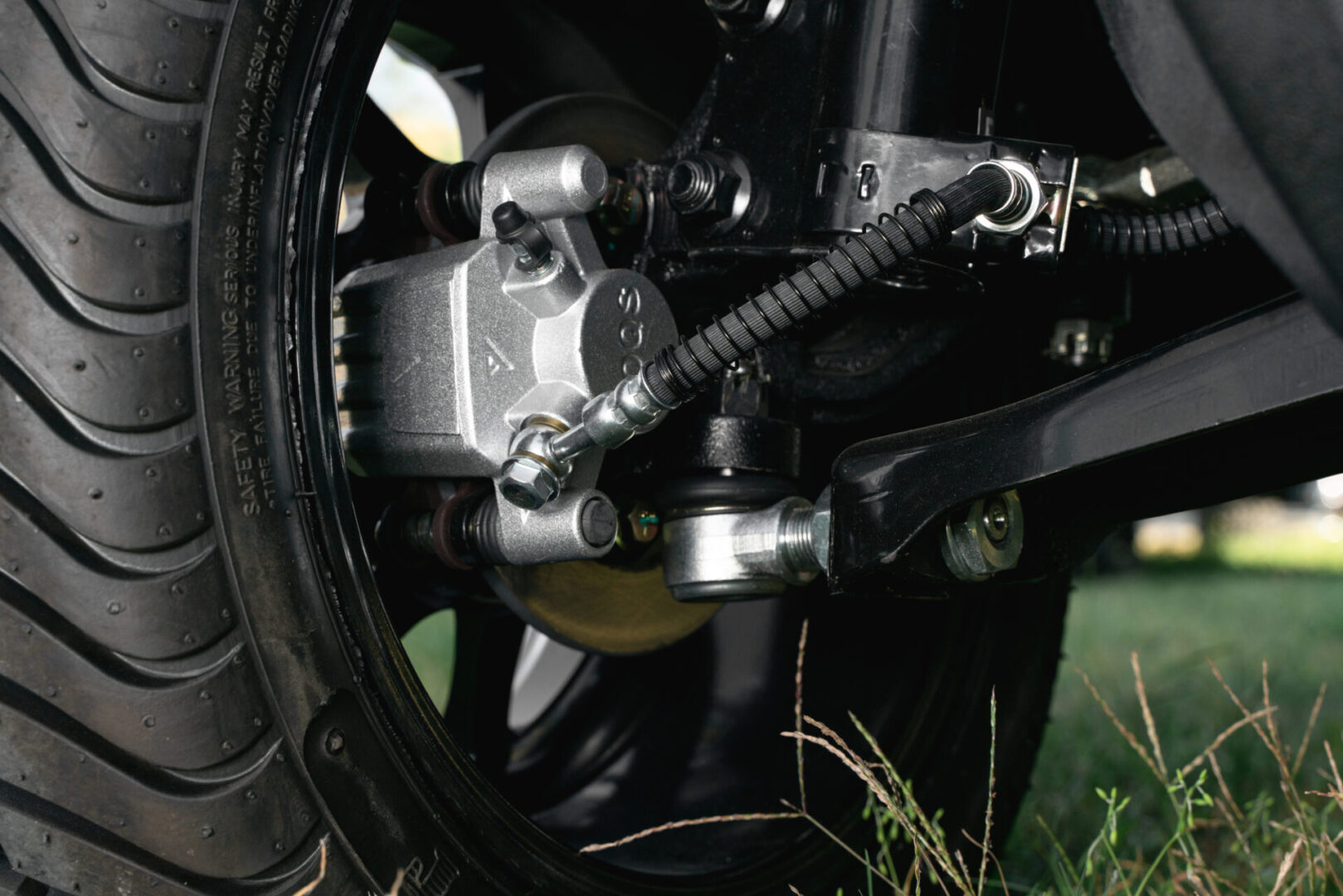 A close up of the front wheel on a motorcycle.