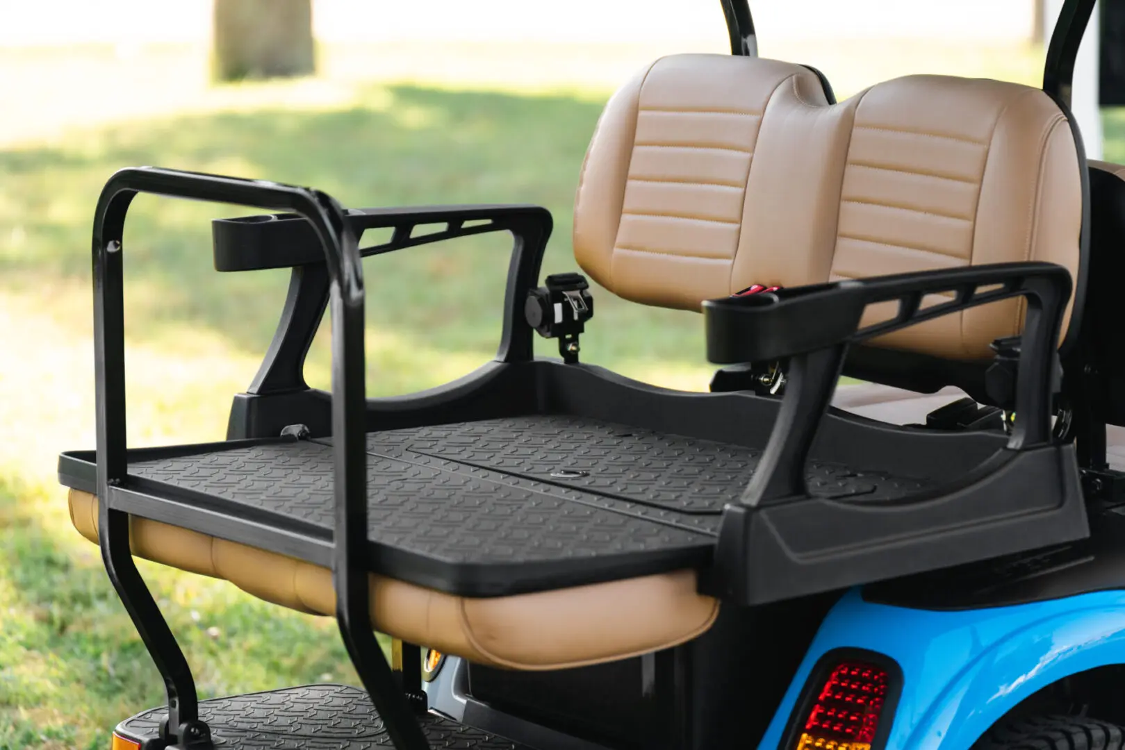 A golf cart with two seats and a table.